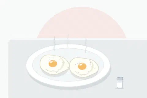 Two poached eggs with a firmly set white on a plate, a rounded glossy yolk visible under a thin veil of egg white